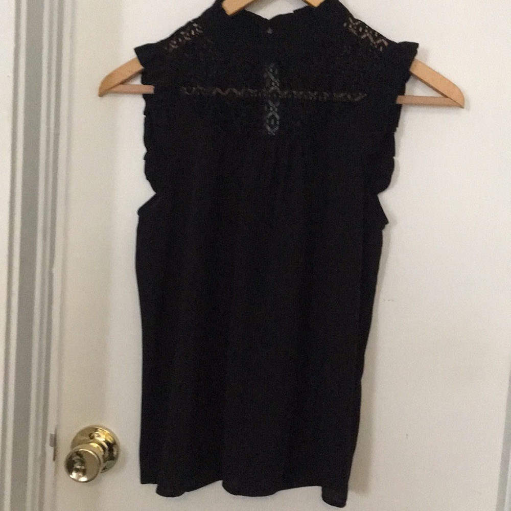 Woman's black high collar blouse